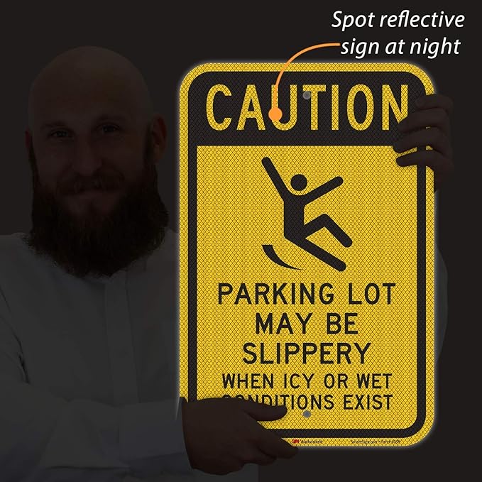 SmartSign 18 x 12 inch “Caution - Parking Lot May Be Slippery When Icy Or Wet Conditions Exist” Metal Sign, 63 mil Aluminum, 3M Laminated Diamond Grade Reflective Material, Black and Yellow, USA-Made