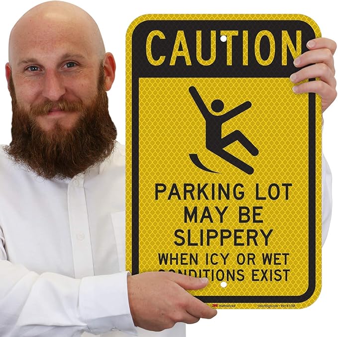 SmartSign 18 x 12 inch “Caution - Parking Lot May Be Slippery When Icy Or Wet Conditions Exist” Metal Sign, 63 mil Aluminum, 3M Laminated Diamond Grade Reflective Material, Black and Yellow, USA-Made
